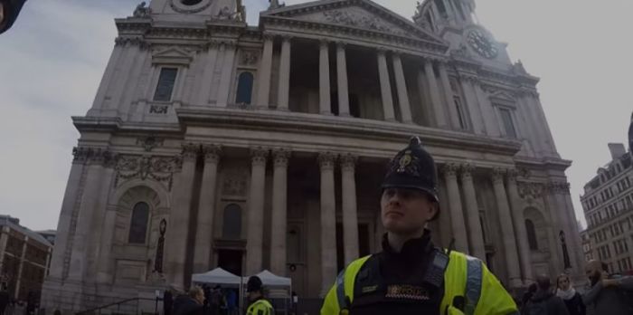 City of London Police interrogating Allan Coote for reading the Bible in public outside St Paul's Cathedral in London, April 19, 2018.