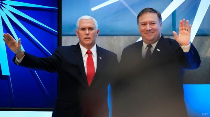 Vice President Mike Pence (L) and Secretary of State Mike Pompeo (R) wave to the participants at the first-ever State Department Ministerial to Advance Religious Freedom at the Harry S. Truman Building in Washington, D.C. on July 26, 2018.