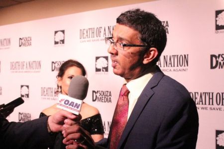 Dinesh D'Souza speaks to reporters at the advanced screening of his documentary