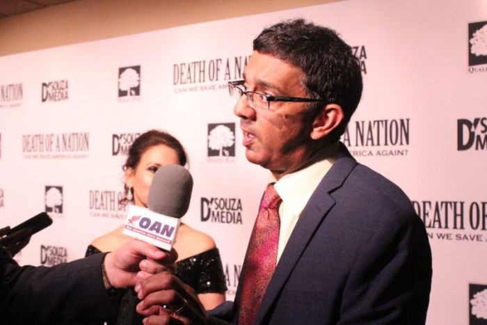 Dinesh D'Souza speaks to reporters at the advanced screening of his documentary 'Death of a Nation' at the E Street Cinema in Washington, D.C. on Aug. 1, 2018.