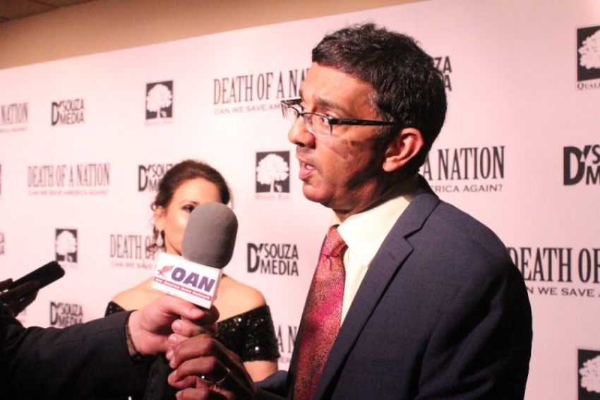 Dinesh D'Souza speaks to reporters at the advanced screening of his documentary 