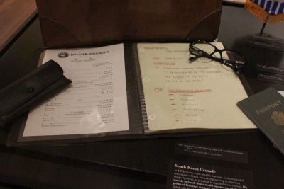 The sermon notes used by Billy Graham during his 1973 South Korea Crusade sits on display at the Museum of the Bible in Washington, D.C. on Aug. 3, 2018. Sitting on top of the sermon are Graham's glasses and passport.