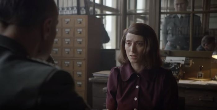 A dramatic scene from the 2018 Dinesh D'Souza documentary 'Death of a Nation' featuring German anti-Nazi student Sophie Scholl (played by Victoria Chilap).