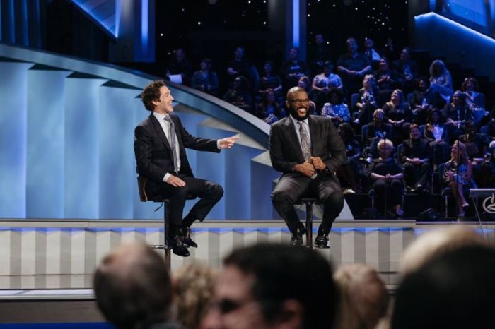 Joel Osteen (L), pastor of Lakewood Church in Houston, Texas, interviews Christian Hollywood film producer Tyler Perry (R) on Sunday, Aug. 5, 2018.