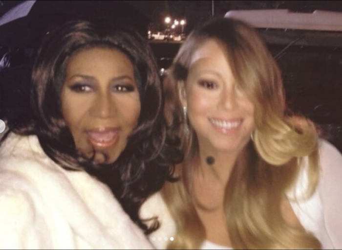 Aretha Franklin and Mariah Carey pose for a photo together. The image was included in a montage of photos used to honor Franklin, who died on Aug. 16, 2018.