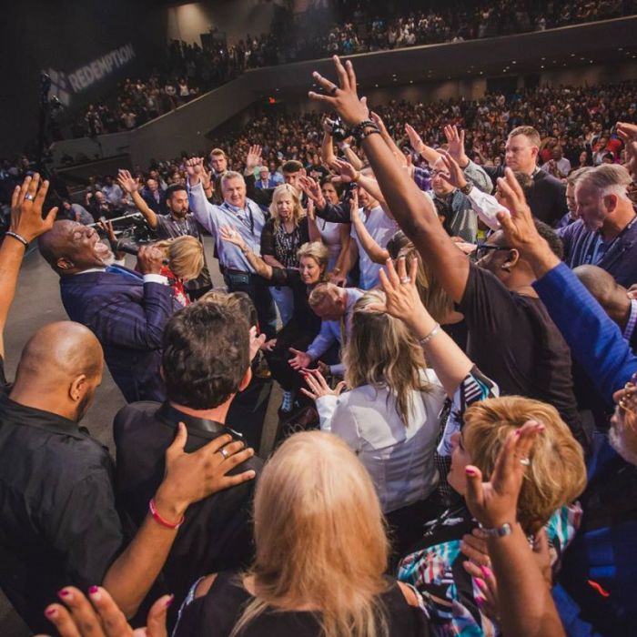 Megachurch pastor and televangelist, Bishop T.D. Jakes and other church leaders bless Pastor Ron Carpenter and his wife Hope, as they are officially installed as pastors of Redemption Bay Area church in San Jose, California, on Wednesday August 22, 2018.