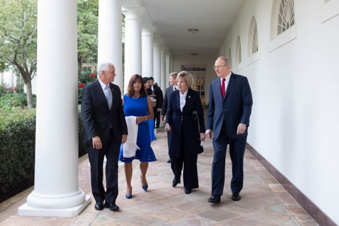 Vice President Mike Pence (L) and his wife, Karen, walk with James Dobson (R) and his wife, Shirley, prior to a dinner with over 100 evangelical leaders at the White House in Washington, D.C. on Aug. 27, 2018.