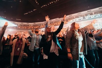 College students worship at Passion, founded by Louie Giglio.