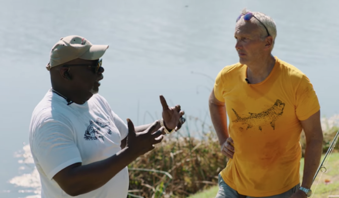 Bishop T. D. Jakes (L) speaks with Pastor Ed Young on a fishing trip.