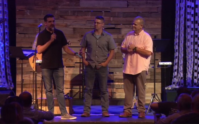 Pastor Darryl Marin (L) speaks during a service of The Hills Church in Evansville, Indiana on Sept. 8, 2018. He is joined on stage by pastors Dave Bowersox (M) and Rick Kyle (R).