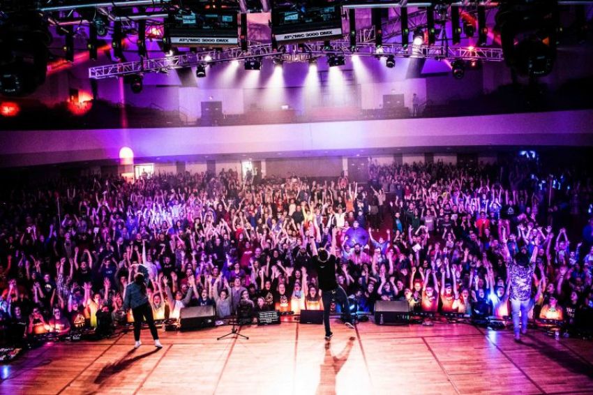 High school students at a Christ in Youth "Move" conference at Lee University in Tennessee interact with stage actors during a main session.