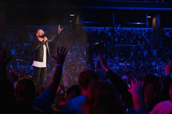 Lead pastor of Hillsong Church, New York City, Carl Lentz worships at the Barclays Center in Brooklyn, New York.
