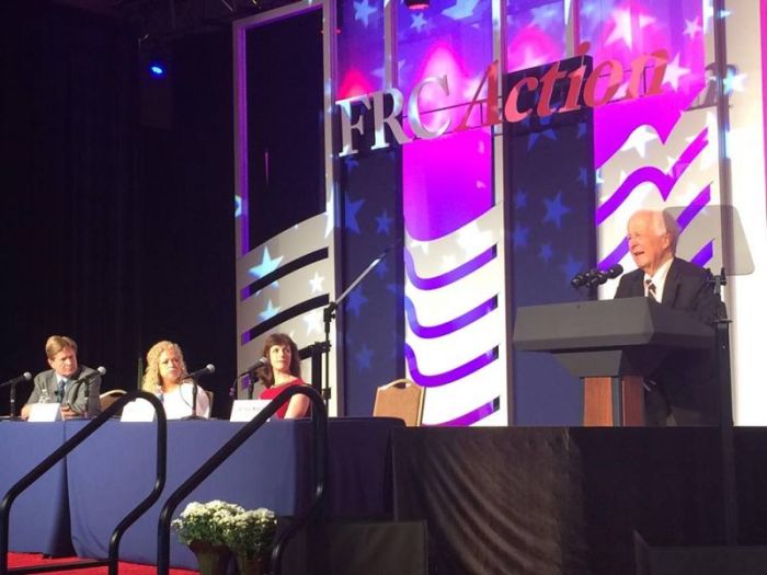 Peter Sprigg of the Family Research Council, activist Elizabeth Johnston, Dr. Michelle Cretella, (from left to right) look on as Dr. Paul McHugh speaks to the Values Voter Summit about the harms of gender ideology on Sept. 22, 2018.