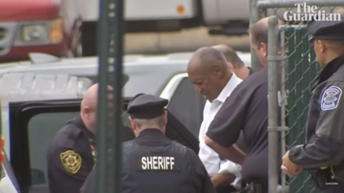 Bill Cosby being led out by police in Pennsylvania following sentencing on September 25, 2018.