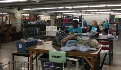 Volunteers sorting things at the Church of the Resurrection's Flourish Furnishings Ministry, based in Grandview, Missouri.