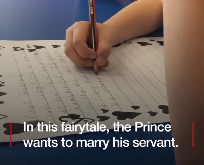 A student completes and assignment to write a fake love letter from a prince to his male servant asking him to get married. The assignment was completed by students at Bewsey Lodge Primary School in Warrington, England.
