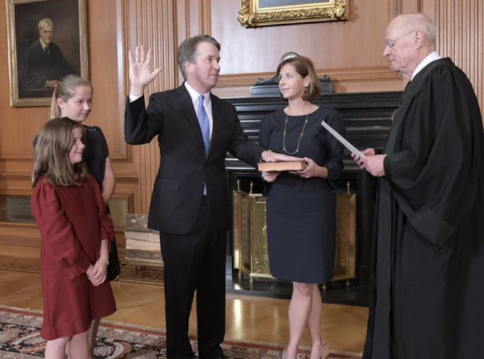 The Honorable Brett M. Kavanaugh was sworn in as the 102nd associate justice of the Supreme Court. Chief Justice John G. Roberts Jr. administered the Constitutional Oath and retired Associate Justice Anthony M. Kennedy administered the Judicial Oath in a private ceremony in the Justices' Conference Room at the Supreme Court in Washington, D.C. on October 6, 2018.
