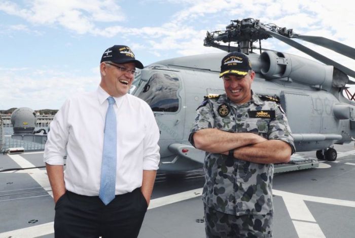 Australian Prime Minister Scott Morrison (L) with a member of the Australian Navy.