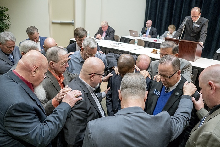 Southwestern Baptist Theological Seminary trustees pray for the presidential search committee at its annual meeting in Fort Worth, Texas, on Oct. 17, 2018.