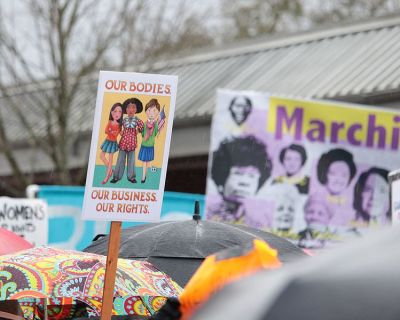 Demonstrators hold up pro-abortion signs at the Women's March in Eugene, Oregon on Jan. 21 2017.