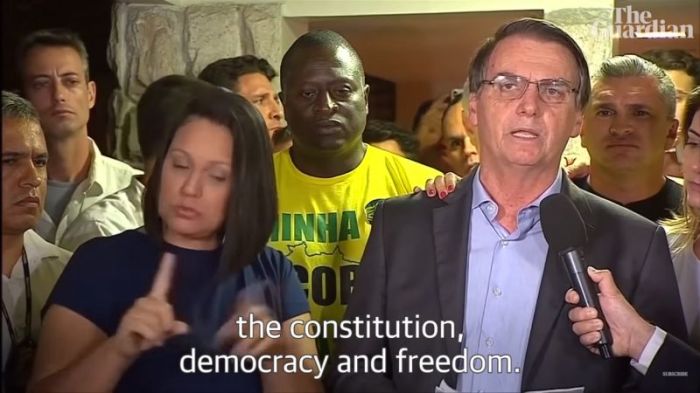 Brazilian politician Jair Bolsonaro (R) following his victory in the presidential election on October 29, 2018.