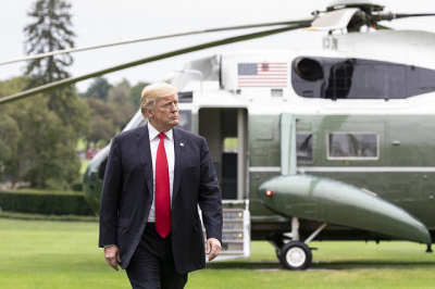 President Donald J. Trump walks across the South Lawn of the White House Sunday, March 25, 2018, returning home from his trip to New York.