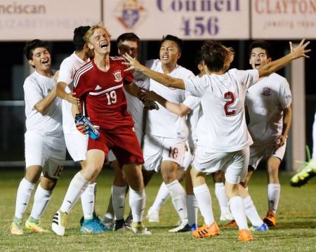 The late Cole Ungaro (in red) celebrates with his soccer team at Faith Christian School.