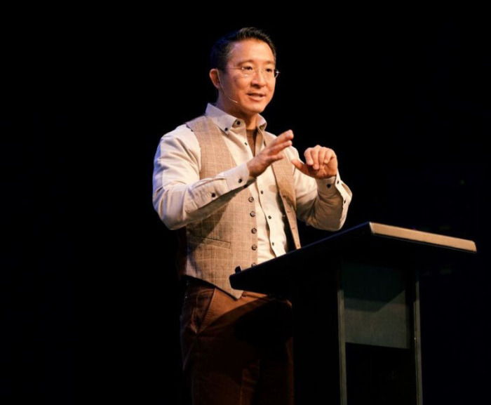 Christopher Yuan speaks at an event, 2018. 