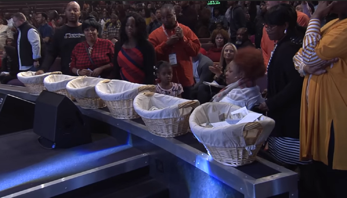 Credit : Pastor John Gray of Relentless Church in Greenville, South Carolina, allowed members in need to take cash from the church’s offering baskets.