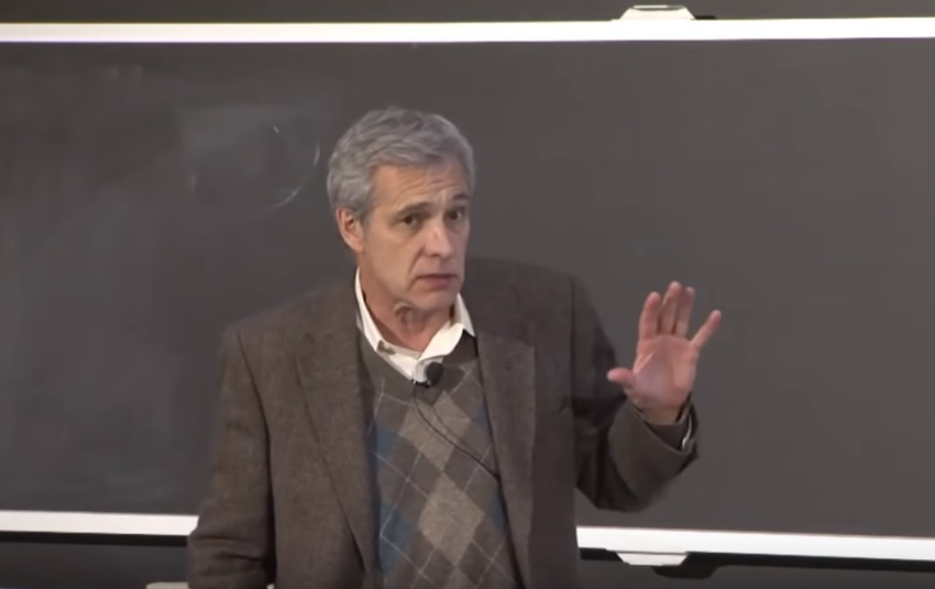 Stanford University neurobiologist William Hurlbut giving a presentation at the Veritas Forum event "Drawing the Line: The Ethics of Gene Editing" held at the Massachusetts Institute of Technology in November 2018. 