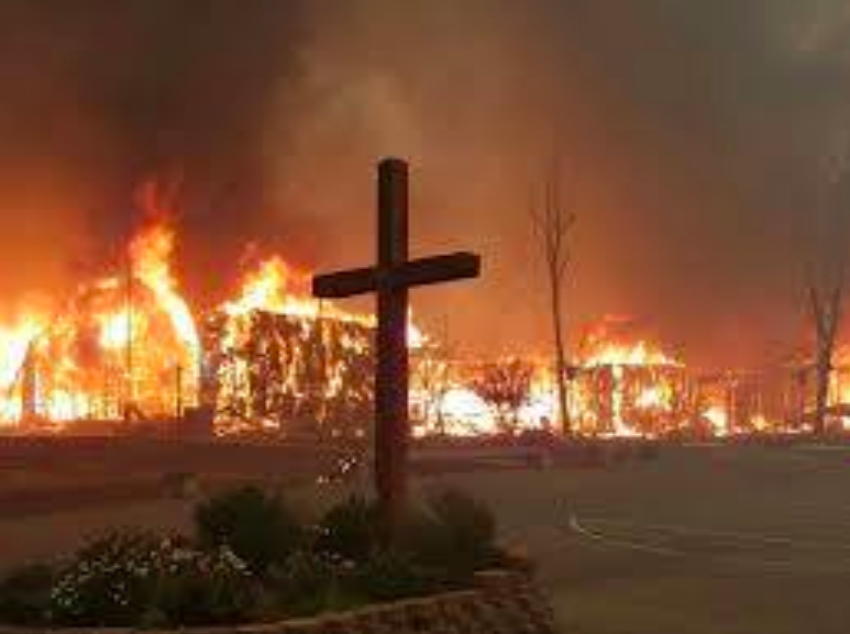 The cross photo was taken by Tyler Frank and Elizabeth Osborn as they escaped the flames.