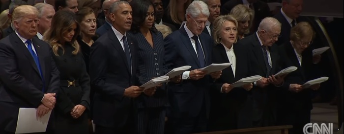 President Donald Trump and his wife Melania not reciting or reading the Apostles' Creed while others around them do so during the funeral of former president George H.W. Bush at the Washington National Cathedral on Wednesday, December 5, 2018.