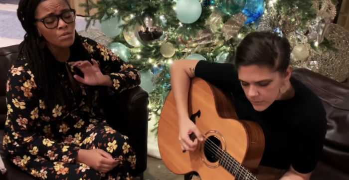 Liz Vice (left) and Hannah Glavor (right) sing a revised version of 'Away in a Manger' that focuses on Jesus' life as a refugee, December 12, 2018. 