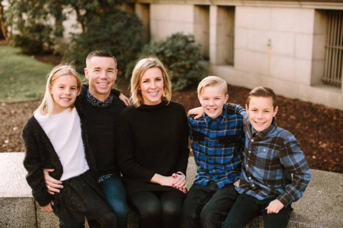 Pastor Tyler Sollie (2nd L) with his wife and children.