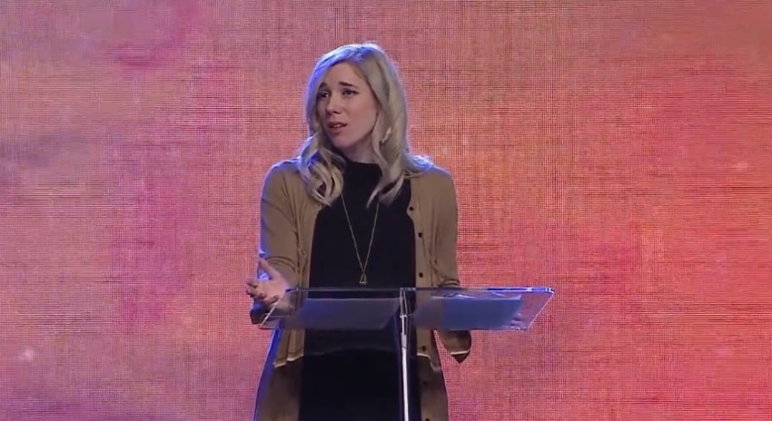 Blythe Hill of "Dressember" addresses the Urbana Student Missions conference in St. Louis, Missouri.