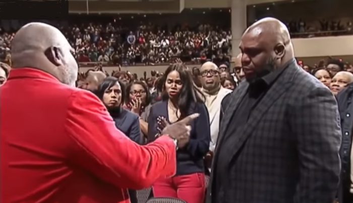 Megachurch pastor Bishop T.D. Jakes rebukes the spirit of suicide from Pastor John Gray (R) of Relentless Church in Greenville, South Carolina.