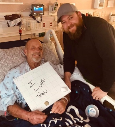 Scott Marr (L) and his son Drew (R) at the Methodist Hospital in Omaha, Nebraska shortly after he recovered from a near-death experience in December 2018.