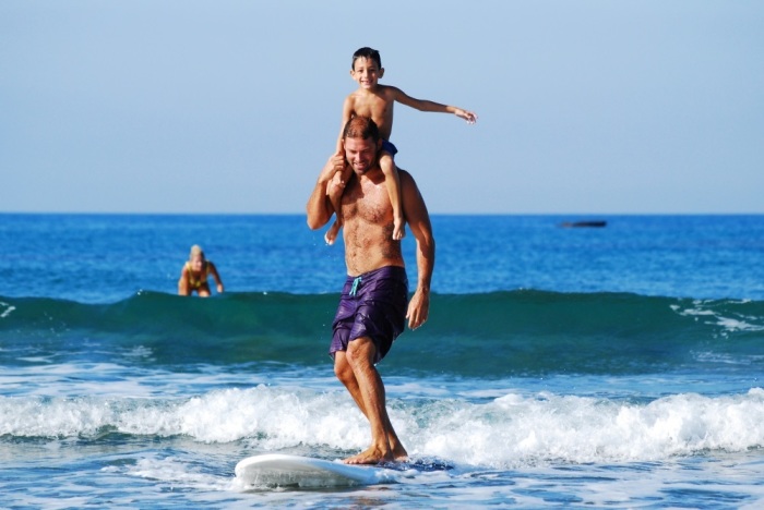 Father and son surfing. 