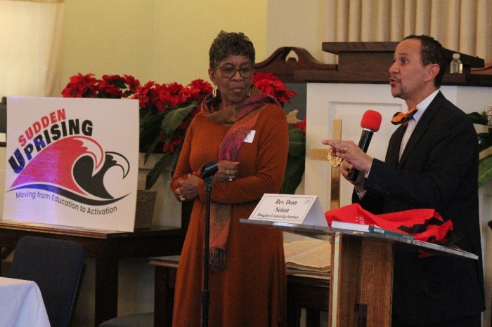 Rev. Dean Nelson, founder of the Douglass Leadership Institute, (R) speaks during the Sudden Uprising conference held at Emmanuel Church of God in Christ in Washington, D.C., on Jan. 18, 2019. To his right stands Catherine Davis, who heads the Georgia-based Restoration Project. 
