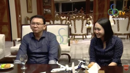 Basuki Tjahaja Purnama (L) and his bride-to-be Puput Nastiti Devi (R) speak with the leader of Hanura party, Oesman Sapta Odang, on Jan. 25, 2019 in a video that was posted to YouTube.
