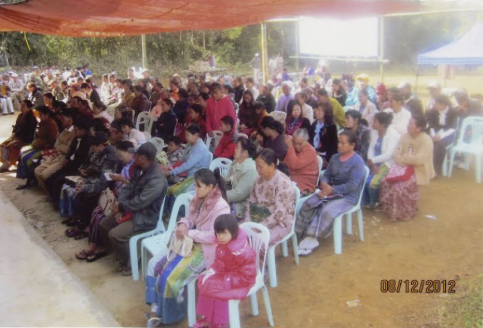 People attend the formal dedication of the first Rumai Palaung church in their community in Myanmar on Aug. 12, 2012. 