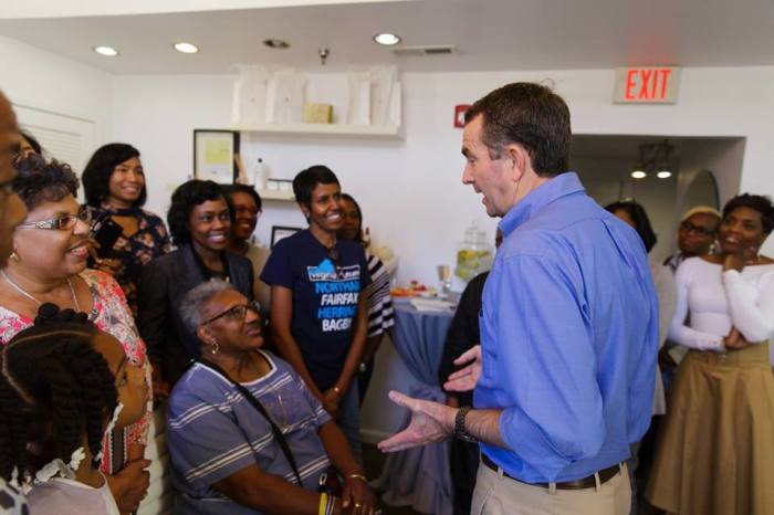 Virginia Gov. Ralph Northam speaks with black constituents in this 2017 photo.