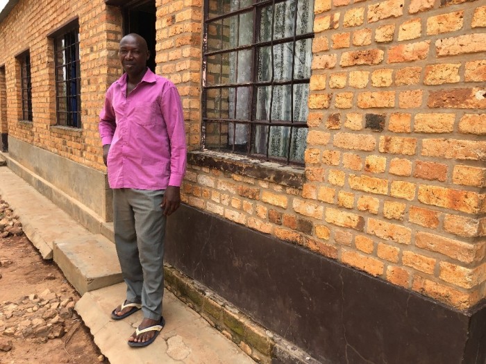 Rwanda genocide survivor Habarurema Bosco poses for a picture outside of the Rugango parish in southern, Rwanda, on Feb. 19, 2019. He was the only survivor of 40 family members from the 1994 genocide against the Tutsis. Now he is married with six children and has overcome a dependency on drugs and alcohol. 