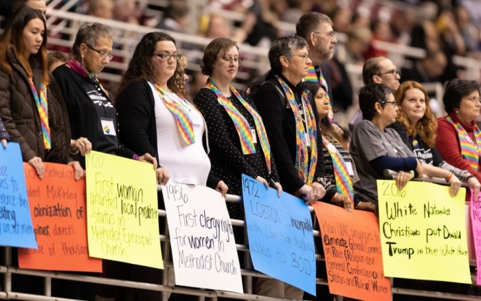 Supporters of full inclusion for LGBT persons in the life of The United Methodist Church demonstrate in the observer's area at the UMC special session of General Conference in St. Louis, Missouri on Monday, Feb. 25, 2019.