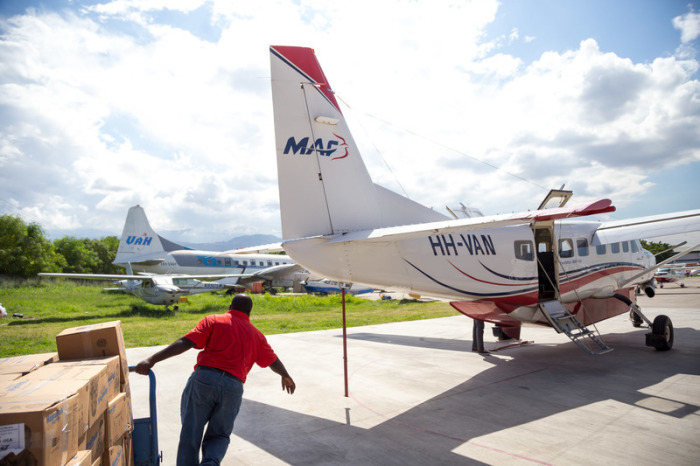 Supplies being loaded into a Cessna 208B Grand Caravan at the Port-au-Prince airport in Haiti. 
