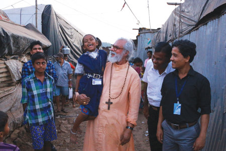 Gospel for Asia founder K.P. Yohannan greets people in Mumbai, India in February 2018.
