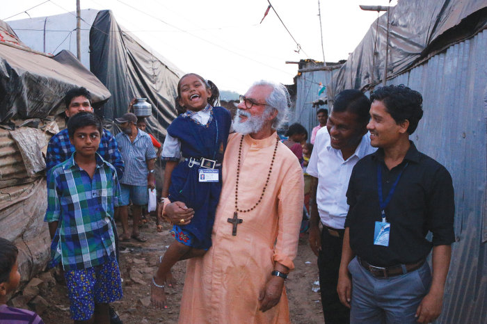 Gospel for Asia founder K.P. Yohannan greets people in Mumbai, India in February 2018. 