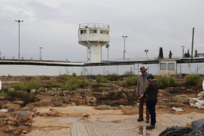 Morgan Freeman studies the archaeological dig with Yonatan Moss at Megiddo Prison in Israel.