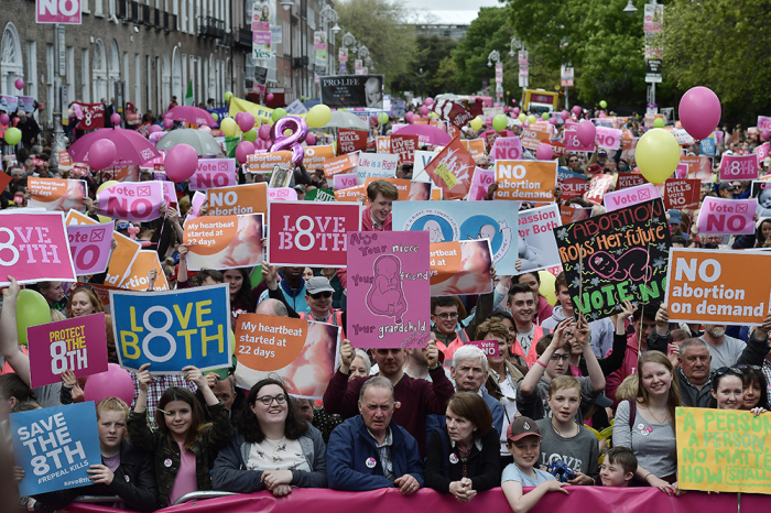 Thousands of No campaign supporters hold placards aloft during a LoveBoth Stand Up For Life rally in Dublin, Ireland, on May 12, 2018. 