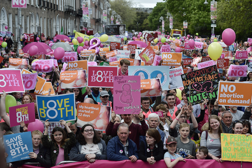Thousands of No campaign supporters hold placards aloft during a LoveBoth Stand Up For Life rally in Dublin, Ireland, on May 12, 2018. 